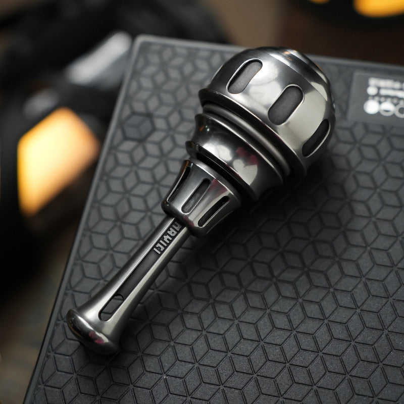Impact Capsule Finger-Spinner with Rachet Button Linkage